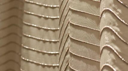 close up of embroidered acoustic curtain concert hall by Annette Douglas for EM2N architects