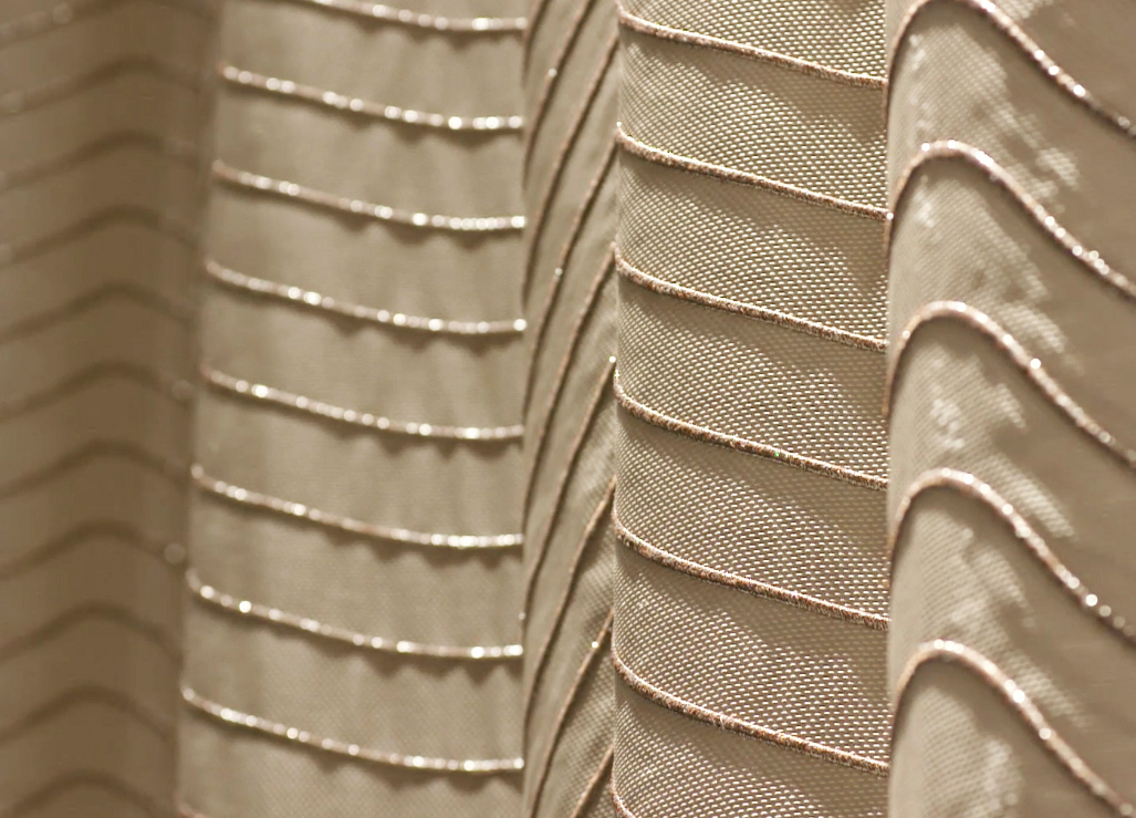 close up of embroidered acoustic curtain concert hall by Annette Douglas for EM2N architects